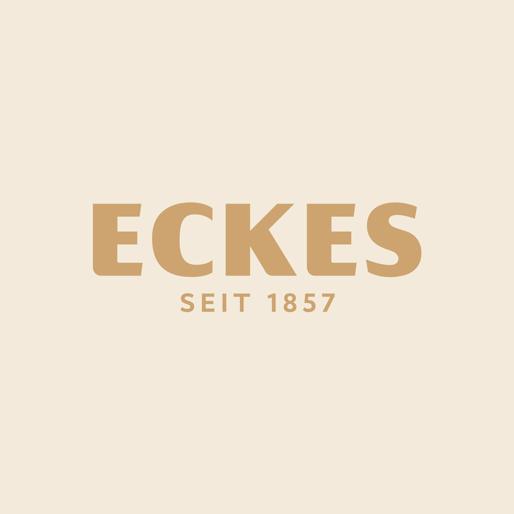 ECKES Logo mit dem Text "Seit 1857" in goldener Schrift auf beigem Hintergrund